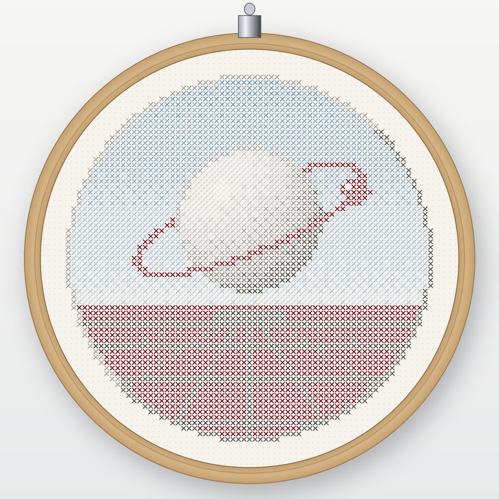 Satellite No. 01: a cross-stitched chrome planet with an oxblood orbit, floating in a round sky window above a red horizon grid, shown in a wooden hoop